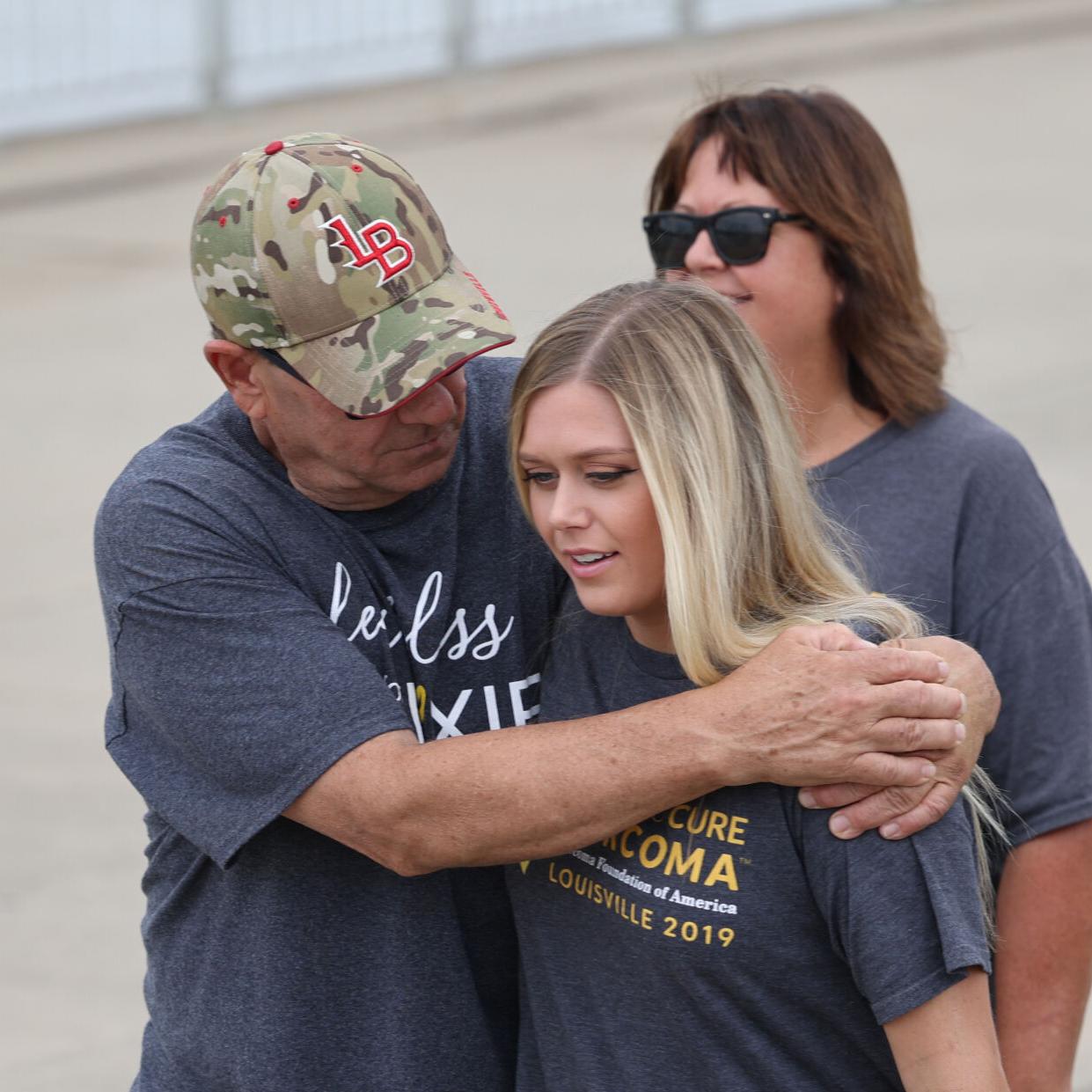Larry Browning embraces Alexis Carrico